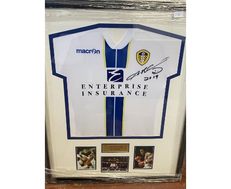 A framed Leeds United football shirt signed by Sugar Ray Leonard 2019, shipping unavailable