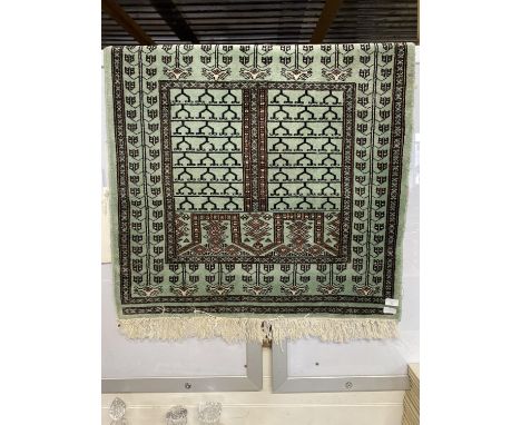 A Persian style green woolen rug 90x200cm, shipping unavailable
