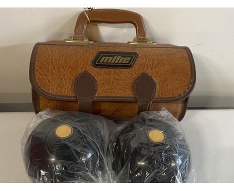 A pair of new unused mitre lawn bowls, shipping unavailable