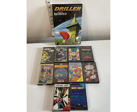 A selection of VIC 20 game cassettes and a sealed Commodore 64 Driller game (untested)