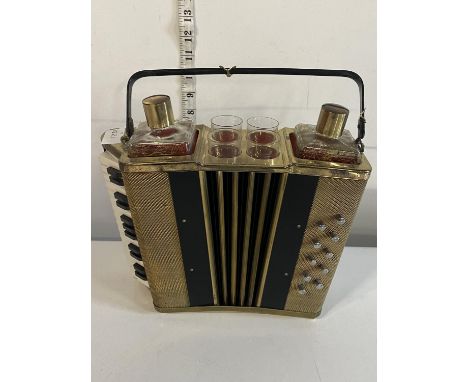 A novelty mid century musical portable cocktail set in the form of a accordion , shipping unavailable