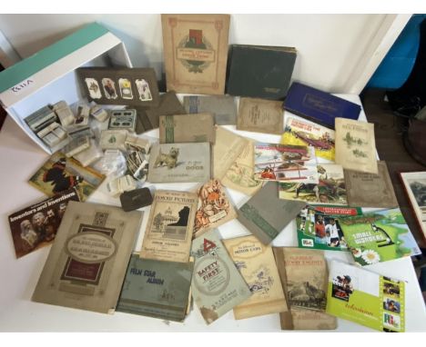 A large selection of assorted cigarette card albums etc