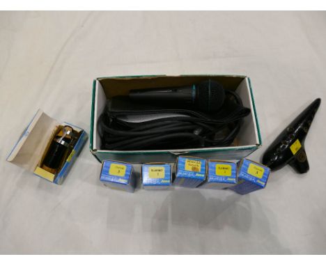 Six boxed clarinet mouthpieces, wooden musical instrument and Sure Model BG1.1 microphone with cables.