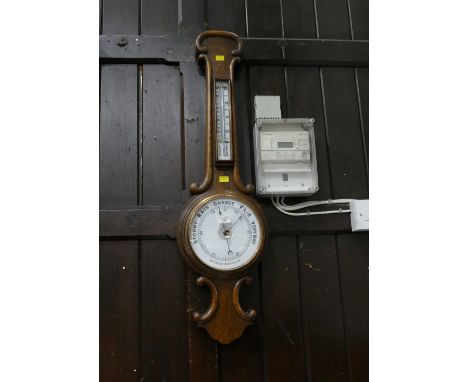 Aneroid barometer in oak case, 90 cm long