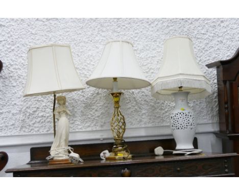 Three lamps, brass based pierced white ceramic base and figural base, all measure approx 60-70 cm high 