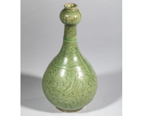 Bottle with globular body at the crown of the foot and high, bulbous neck at the end in thick porcelain with incised decorati