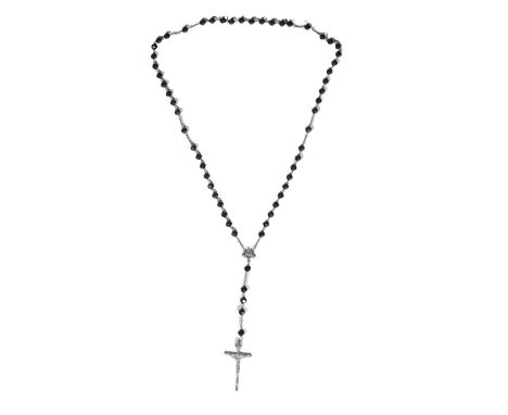 This Spanish rosary, created in the 20th century, is designed with black glass beads that evoke a sense of sobriety and penit