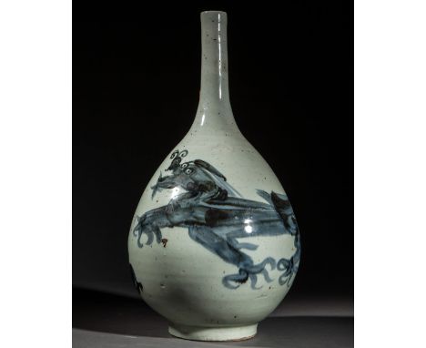 top bottle in white enameled porcelain decorated with underglaze cobalt blue dragons. Porcelain. 19th century. Height 76 cm x