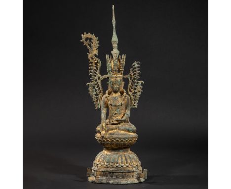 Ornate Maravijaya Buddha, seated in Bumishparsha Mudra on a lotiform base, topped with a large winged crown topped with a tal