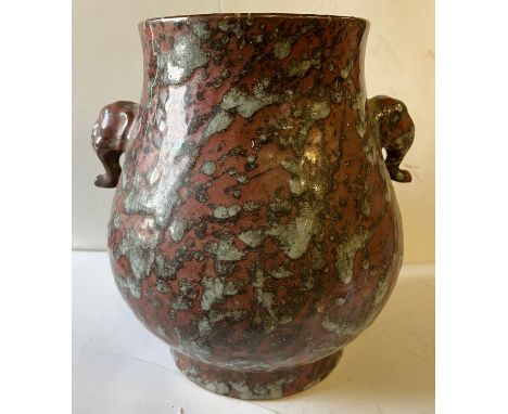 Pot-bellied pot with a very flared crater crown and neck set with a pair of zoomorphic handles on the shoulder in marbled por