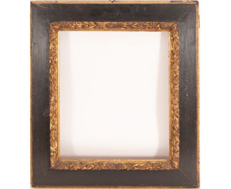 In gilded and ebonized wood. Exterior measurements: 76 x 66, light measurements: 56 x 45
