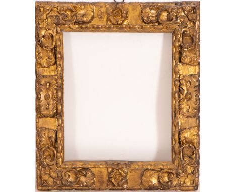 In carved and gilded wood. Exterior measurements: 75 X 71, light measurements: 53 X 50