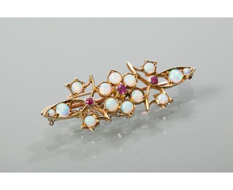 OPAL AND RUBY BAR BROOCH
of pierced design, set with cabochon opals and round rubies, unmarked