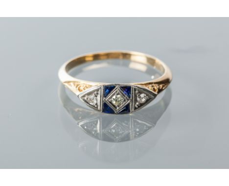 ART DECO SAPPHIRE AND DIAMOND RING
with three round diamonds and three triangular sapphires, in a scrolling design setting, m