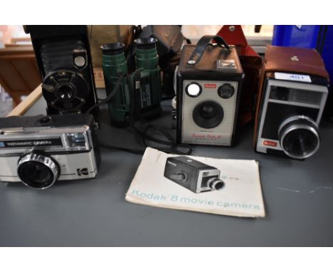 A selection of cameras including Coronet vest camera, Brownie Flash III, Kodak 8 movie camera, Instamatic 177X and a pair of 