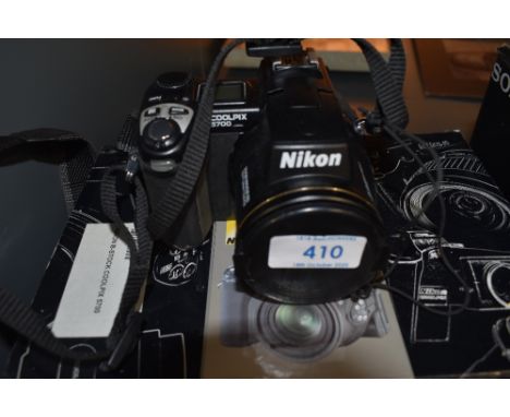 A Nikon Cool Pix 5700 digital camera in original box with charger etc