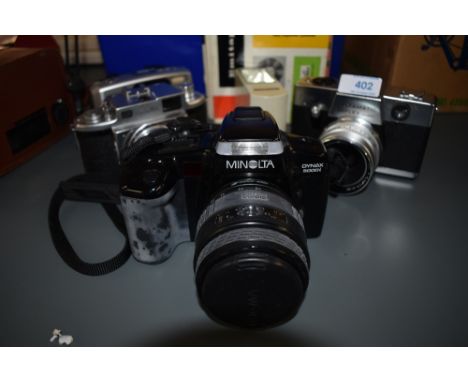 A selection of cameras including Minolta Dynax 5000i, Minolta A, Kodak Instamatic Reflex, a Pentax ESPIO 115V as well three r