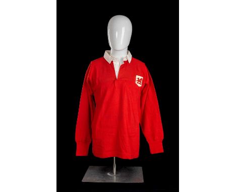 JPR WILLIAMS | LONDON WELSH | 1968-1976Match-worn jersey in red with white collar, bears felt shield with red dragon embroide