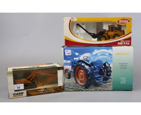 2 boxed diecast construction vehicles together with tractor 
