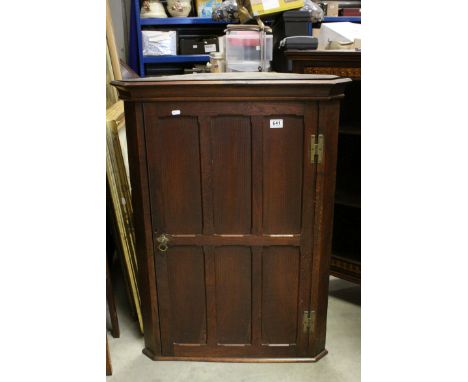 19th century Oak Hanging Corner Cabinet, the single panelled door opening to reveal two shelves, 75cms wide x 101cms high tog