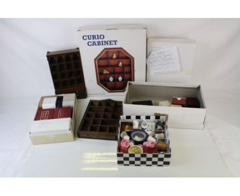 A collection of thimbles to include Royal Worcester and Coalport together with a selection of thimbles shelves and holders. 