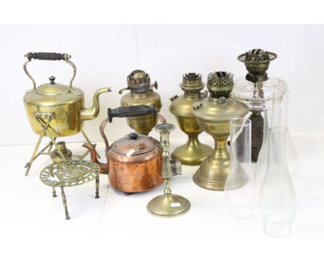 Four vintage paraffin lamp bases together with a group of metalware to include spirit kettle. 