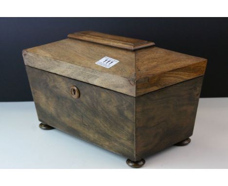 Regency Mahogany Sarcophagus Tea Caddy with two compartments and central space for mixing bowl, raised on four squat bun feet
