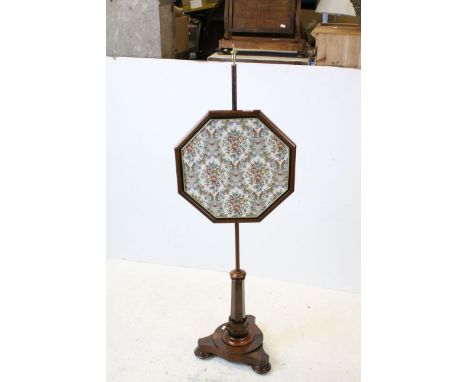 Mid 19th century Rosewood Pole Screen, with brass finial and octagonal framed tapestry panel, raised on a circular platform b