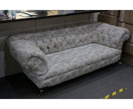Victorian Chesterfield Drop-end Sofa, button back reupholstered, raised on turned wooden legs with brass castors, 214cms long
