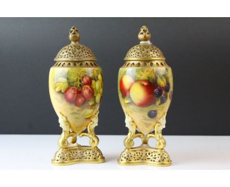 Pair of Royal Worcester Urns with Pierced Lids, hand painted with fruits and signed E Townsend, puce marks, 21cms high (both 