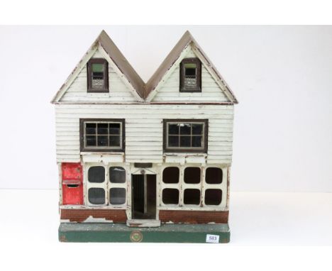 A vintage wooden dolls house. 