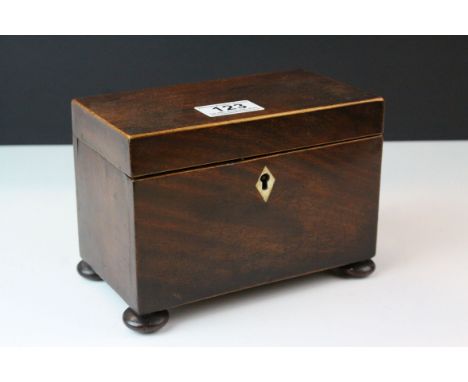Early 19th century Mahogany and Satinwood Inlaid two compartment Tea Caddy raised on four bun feet, 18cms long 