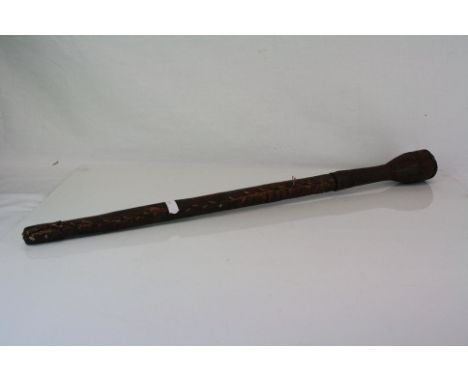 A vintage Asian leather covered stick with decorative tooling (Possibly sword stick). 