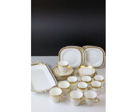 A quantity gilt decorated cups and saucers to include Doulton,Mintons etc. 
