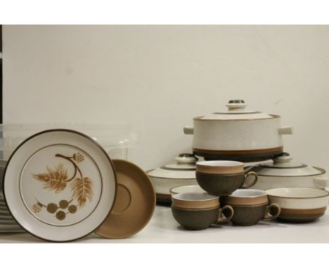 A Denby Cotswold Range stoneware cups and saucers plates,together with tureens and plates from the same range.