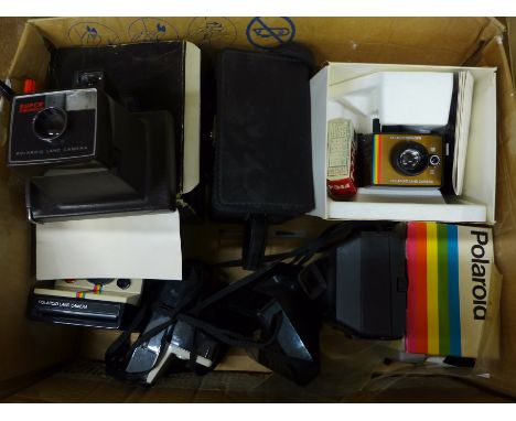 A collection of Polaroid cameras 