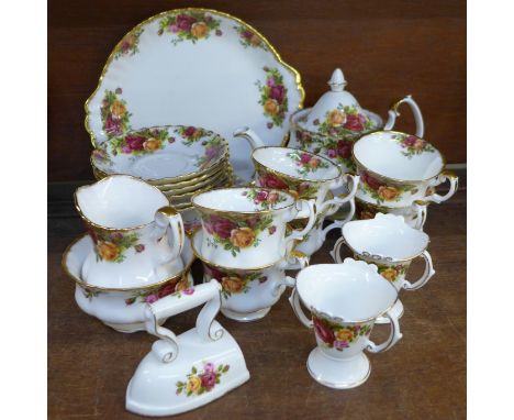 A Royal Albert Old Country Roses six setting tea set with sandwich plate, cream, sugar and teapot, plus three items of Cottag