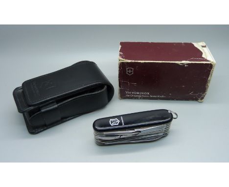 A Victorinox Swiss Army utility knife with leather case 