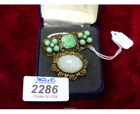 A late 19th century Chinese Jade, grey oval carved brooch mounted in delicate filigree, front and reverse stamped CHINA and a