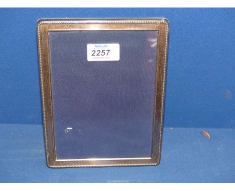 A Silver photograph frame, Sheffield 1995, 8" x 6".