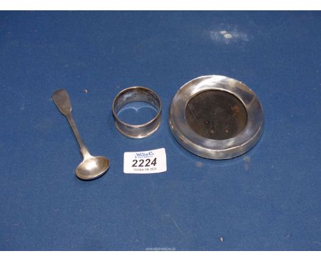 A Silver napkin ring, Sheffield 1981, a silver mustard spoon and a silver circular photograph frame, London 1919.