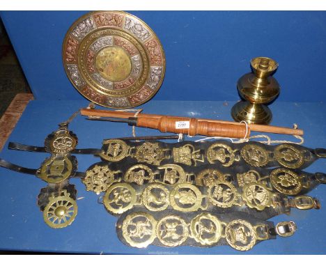 Five brass martingales, a circular brass wall plaque, oil lamp base, etc.