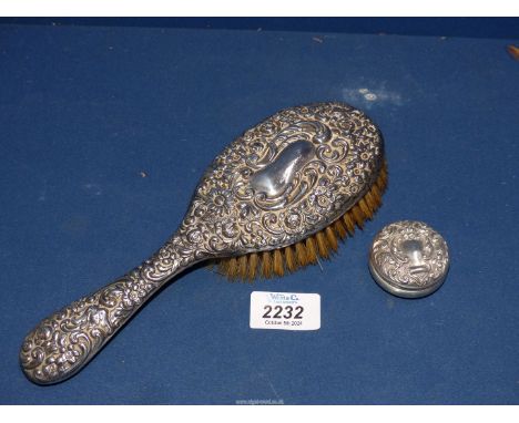 A Silver repousse backed brush, 9" long, Birmingham 1907, maker Henry-Manton, plus a silver bon bon circular box repousse lid