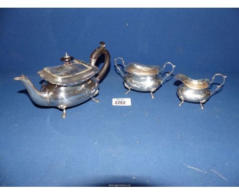 A three piece Silver Teaset with piecrust rims; comprising teapot, having ebonised finial and handle, dated 1901 marked J.R. 