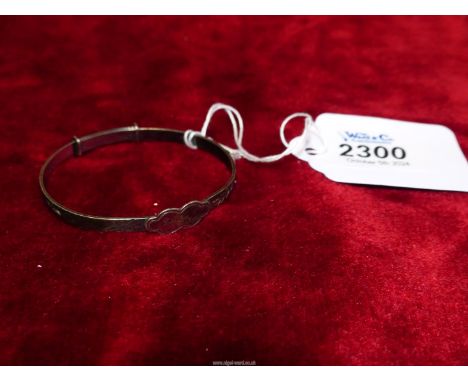 A Silver adjustable christening bangle.