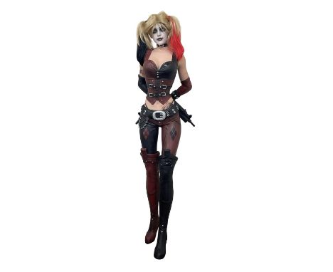 A life-sized mannequin modelled as Batman's Harley Quinn, from the Arkham Asylum game series.Height approximately: 181cm
