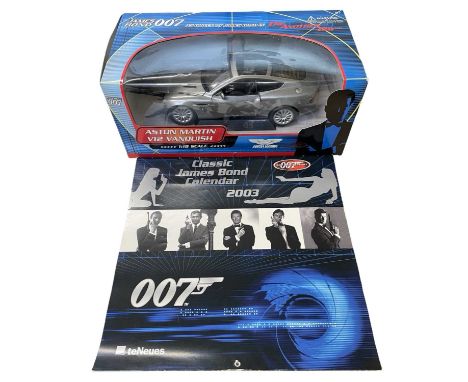 A boxed 1:18 scale James Bond Aston Martin V12 Vanquish model, together with 2003 calendar