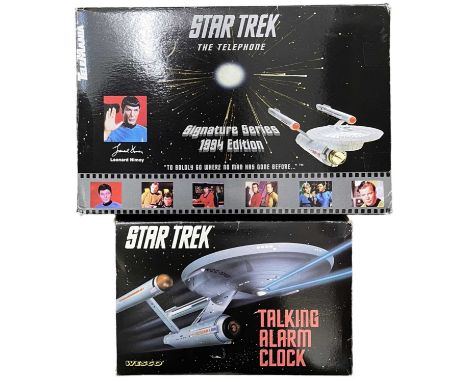 A pair of Star Trek homewares modelled after the USS Enterprise, to include: - Telephone - Alarm Clock