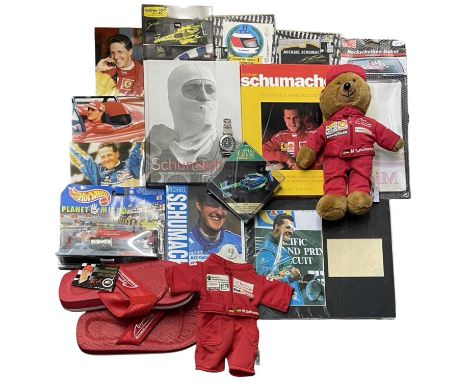 A collection of various Michael Schumacher memorabilia, to include autograph card (unautheticated by Keys Auctioneers), books
