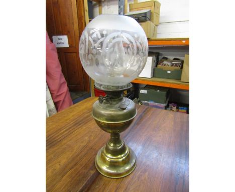 Brass based oil lamp with globe